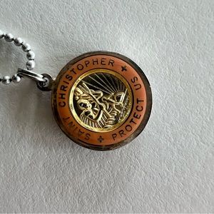 get back I Saint Christopher medallion on ball chain. Like new. Surfer on back.